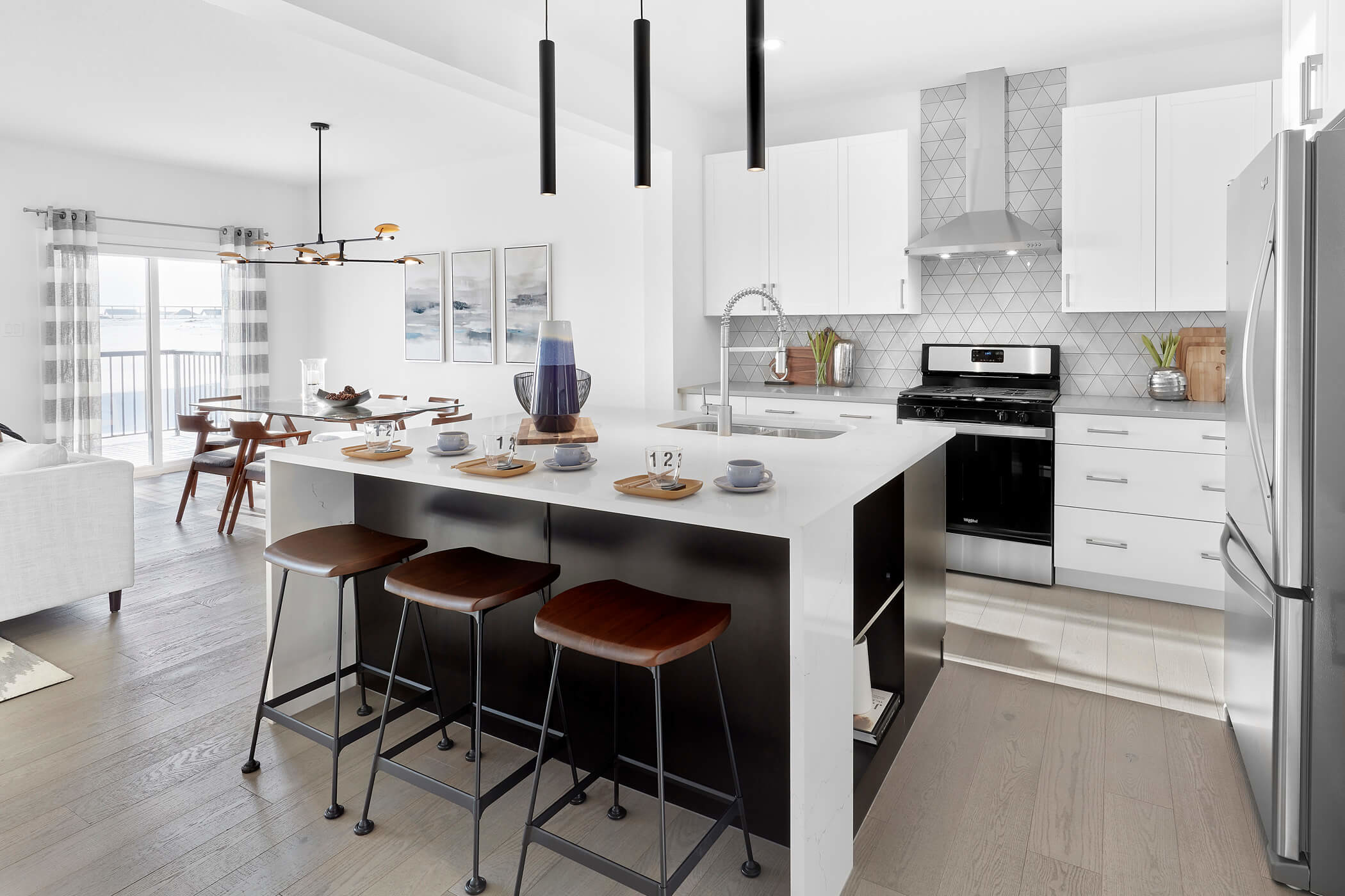 White and Black Kitchen with Modern Finishes in The Grahame Showhome in Rosewood at Secord